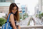 Portrait Of Thai Chinese Adult Beautiful Girl Denim Blue Bag Travel Relax And Smile Stock Photo
