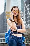 Portrait Of Thai Chinese Adult Glasses Beautiful Girl Denim Blue Calling Smart Phone Stock Photo