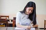 Portrait Of Thai Teen Beautiful Girl Writing Book Stock Photo