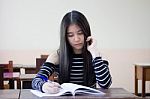 Portrait Of Thai Teen Beautiful Girl Writing Book Stock Photo