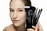 Portrait Of The Beautiful Woman With Make-up Brushes Stock Photo
