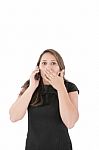 Portrait Of Woman Making A Phone Call Against A White Background Stock Photo
