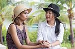 Portrait Of Young Asian Woman Friends Talking To Consult Serious Stock Photo
