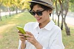 Portrait Of Young Beautiful Asian Woman And Smart Phone In Hand Smiling Toothy Face Connecting Mobile Phone In Hand Use For People Modern Life Style In Digital Trend Stock Photo