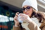 Portrait Of Young Beautiful Woman Drinking Coffee Outdoor Stock Photo