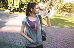 Portrait Of Young Beautiful Woman In Sport Wearing Drinking Wate Stock Photo