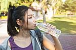 Portrait Of Young Beautiful Woman In Sport Wearing Drinking Wate Stock Photo