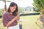 Portrait Of Young Beautiful Woman Reading Message Text On Mobile Stock Photo