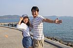 Portrait Of Young Man And Woman Relaxing And Happy Emotion On Sea Side Use For People Relax And Feel Free On Vacation Go To Beautiful Nature Destination Stock Photo