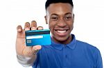 Portrait Of Young Man Holding Credit Card Stock Photo