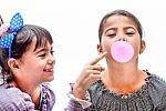 Portraits Of Beautiful Little Girls Blowing Bubbles Stock Photo
