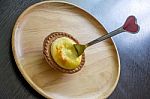 Portuguese Egg Tart On A Wood Dish Stock Photo