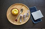 Portuguese Egg Tart On A Wood Dish With White Greeting  Blank Paper Stock Photo