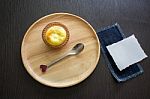 Portuguese Egg Tart On A Wood Dish With White Greeting  Blank Paper Stock Photo