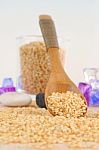 Pouring Sesame From Wooden Spoon Stock Photo