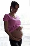 Pregnant Woman At Home Stock Photo