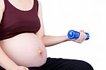 Pregnant Woman Exercising With Dumbbell Stock Photo