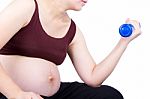 Pregnant Woman Exercising With Dumbbell Stock Photo