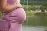 Pregnant Woman Holding Belly Stock Photo