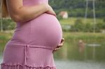 Pregnant Woman Holding Belly Stock Photo