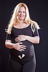 Pregnant Woman Holding Tummy Stock Photo
