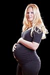 Pregnant Woman Holding Tummy Stock Photo