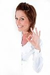 Pretty Female Showing An OK Sign Stock Photo