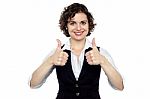 Pretty Lady Gesturing Double Thumbs Up Stock Photo