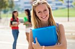 Pretty Student Girl With Some Friends At The Campus Stock Photo