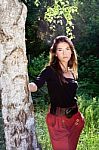 Pretty Woman On Sunny Day In Park Stock Photo