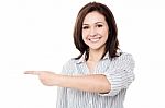Pretty Woman Pointing In Different Direction Stock Photo