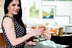 Pretty Woman Receiving Her Drink In Bar Stock Photo