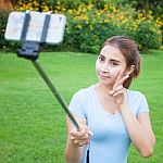 Pretty Young Female Tourist Takes Travel Selfie Stock Photo