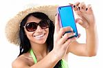 Pretty Young Girl With Green Bikini Taking Selfies With Her Smar Stock Photo