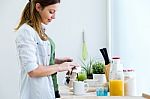 Pretty Young Woman Enjoying Breakfast In The Kitchen Stock Photo