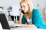 Pretty Young Woman Working With Laptop At Home Stock Photo