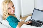 Pretty Young Woman Working With Laptop At Home Stock Photo