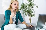 Pretty Young Woman Working With Laptop At Home Stock Photo