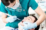Professional Dentist Doing Teeth Checkup Stock Photo