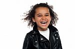 Profile Shot Of An Elementary Kid Laughing Heartily Stock Photo