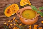 Pumpkin Soup In Clay Pot With Fresh Pumpkins Stock Photo