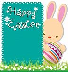 Rabbit And Easter Eggs On Green Grass Stock Photo