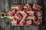 Raw Angus Beef Slices On The Old Wooden Table Horizontal Stock Photo