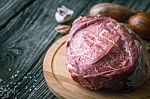 Raw Angus Beef  With Seasoning On The Wooden Table Horizontal Stock Photo