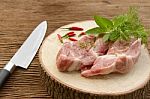 Raw Pork On Cutting Board And Vegetables Stock Photo