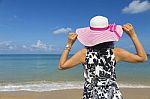 Rear View Of Beautiful Brunette Woman Happy And Enjoy Tropical Beach Stock Photo