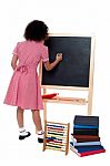 Rear View Of School Girl In Maths Class Stock Photo