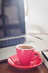 Red Coffee Cup With Notepad And Laptop Stock Photo