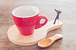 Red Mug With Wooden Plate Stock Photo