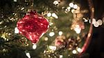 Red Ornament On Elegant Christmas Tree Stock Photo